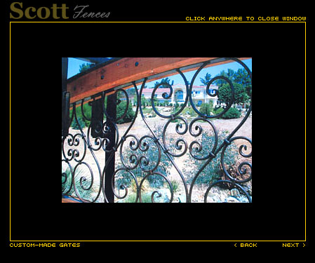 SLIDE GATE WITH WOOD AND SCROLL DESIGN