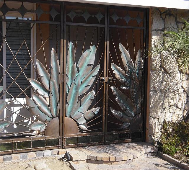 COURTYARD ENRTY GATES-INLAID GLASS AND LEAVES