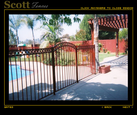 ARCHED IRON POOL GATE WITH CIRCLE DESIGN