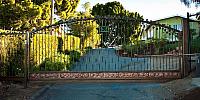 CUSTOM IRON GATE WITH COPPER KICK PLATE
